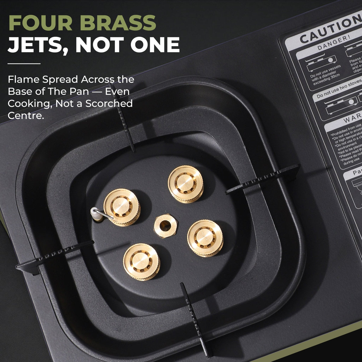 Close-up of the four brass jets in the recessed burner bowl of the FlameGuard Ranger camping stove