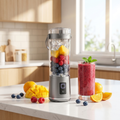 NEWDRU gray portable blender bottle lifestyle photo with fresh fruit and a smoothie